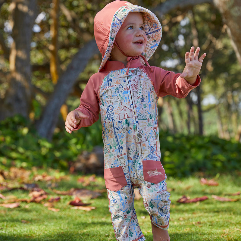 Baby boy wearing UV Skinz's boy's long-sleeve swimsuit in campfire doodle|campfire-doodle