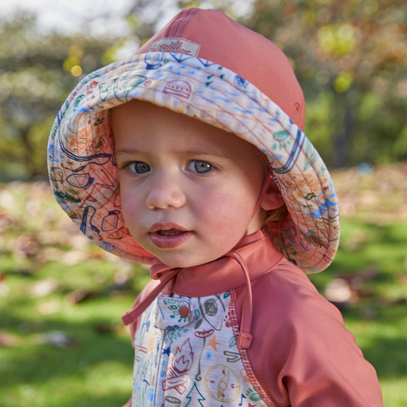 Baby boy in UV Skinz's baby boy's sun hat in campfire doodle|campfire-doodle