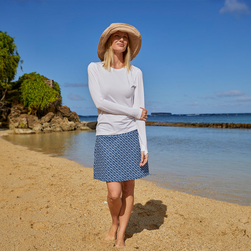 Woman Near the Water Wearing Her UV Skinz's Women's Travel Skort in Serenity Fish|serenity-fish